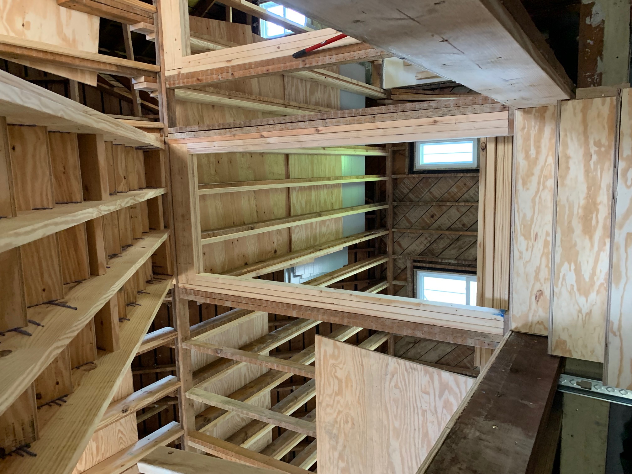 Opened frame from below — exposed joists and reinforced beams